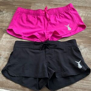 Two pair of sun shorts - TunaSkin Brand. Black has pockets, pink does not.